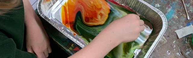 child mixing slime colours