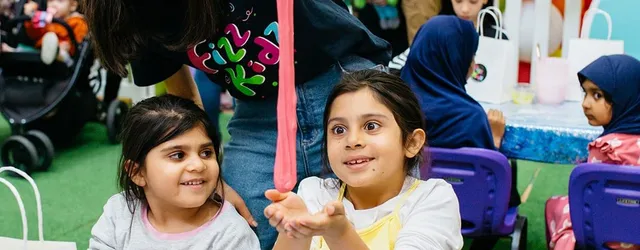 A child playing with slime they made