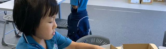 child creating an electricity box