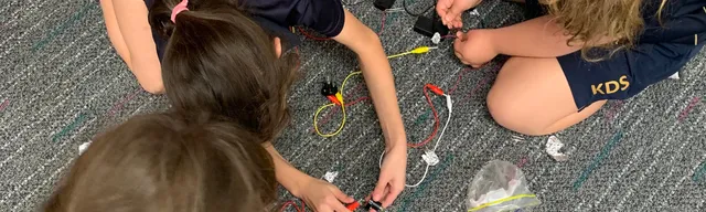 children experimenting with circuitry
