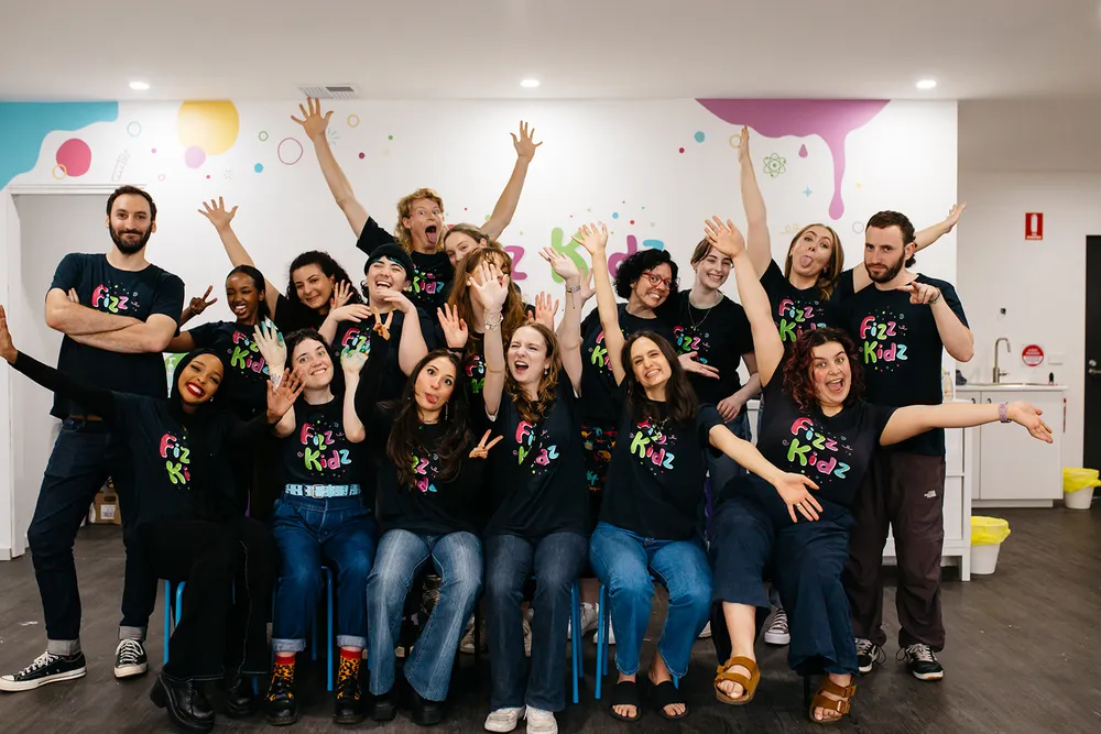 Lots of Fizz Kids staff all posing and laughing