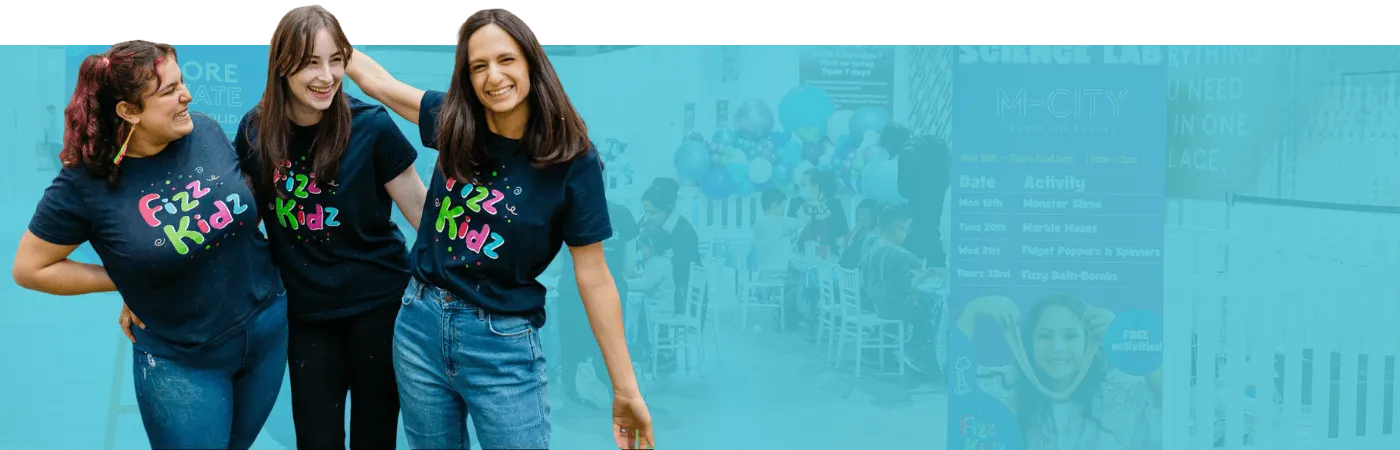 full width image of Fizz Kids staff smiling