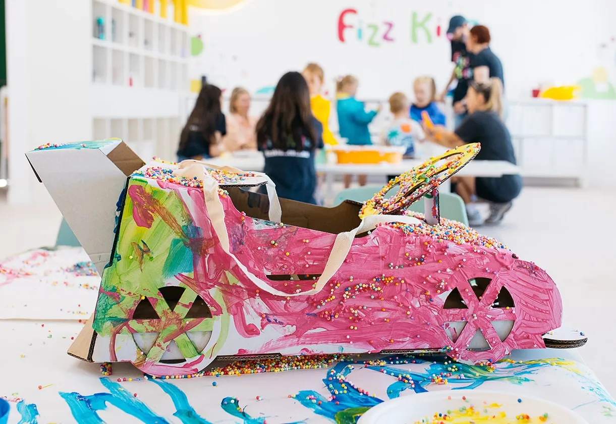 A cardboard car covered in paint