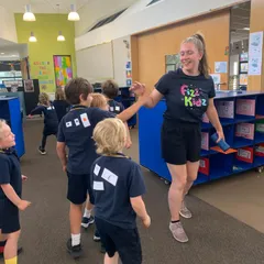 fizz kids staff high fiving children