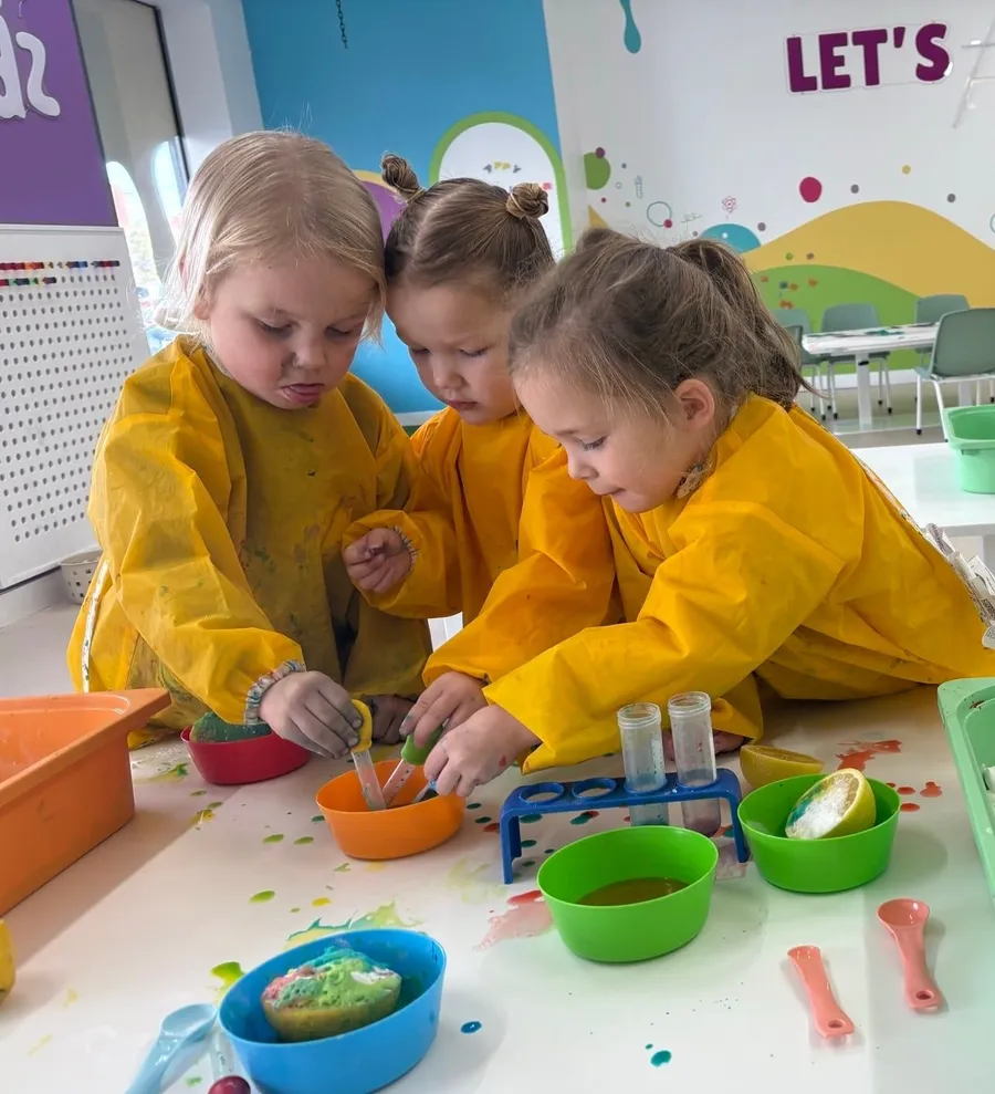 Child painting during a Messy Play Lab session