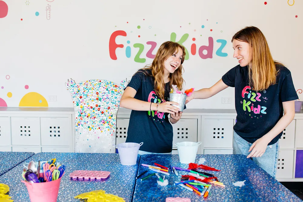 Two Fizz Kids staff working and smiling
