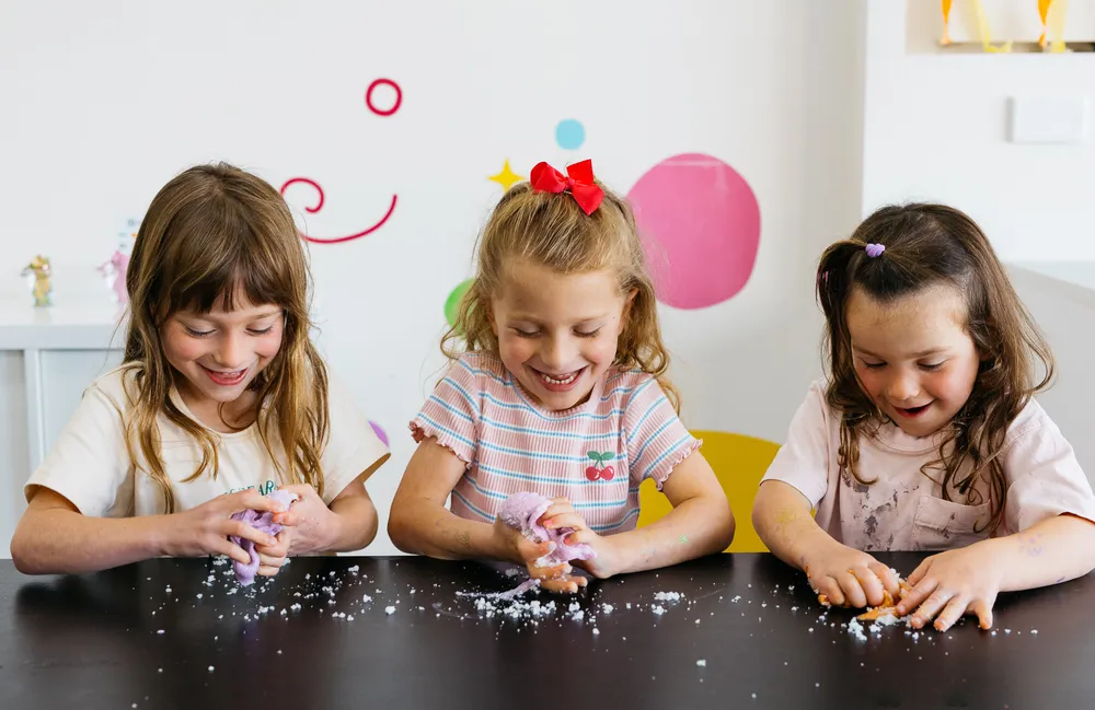 Kids holding slime