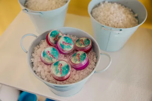 Lip balms in a bowl of bath crystals