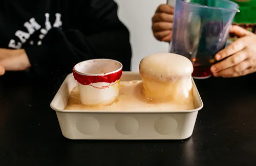 Kids making bubbling volcanos